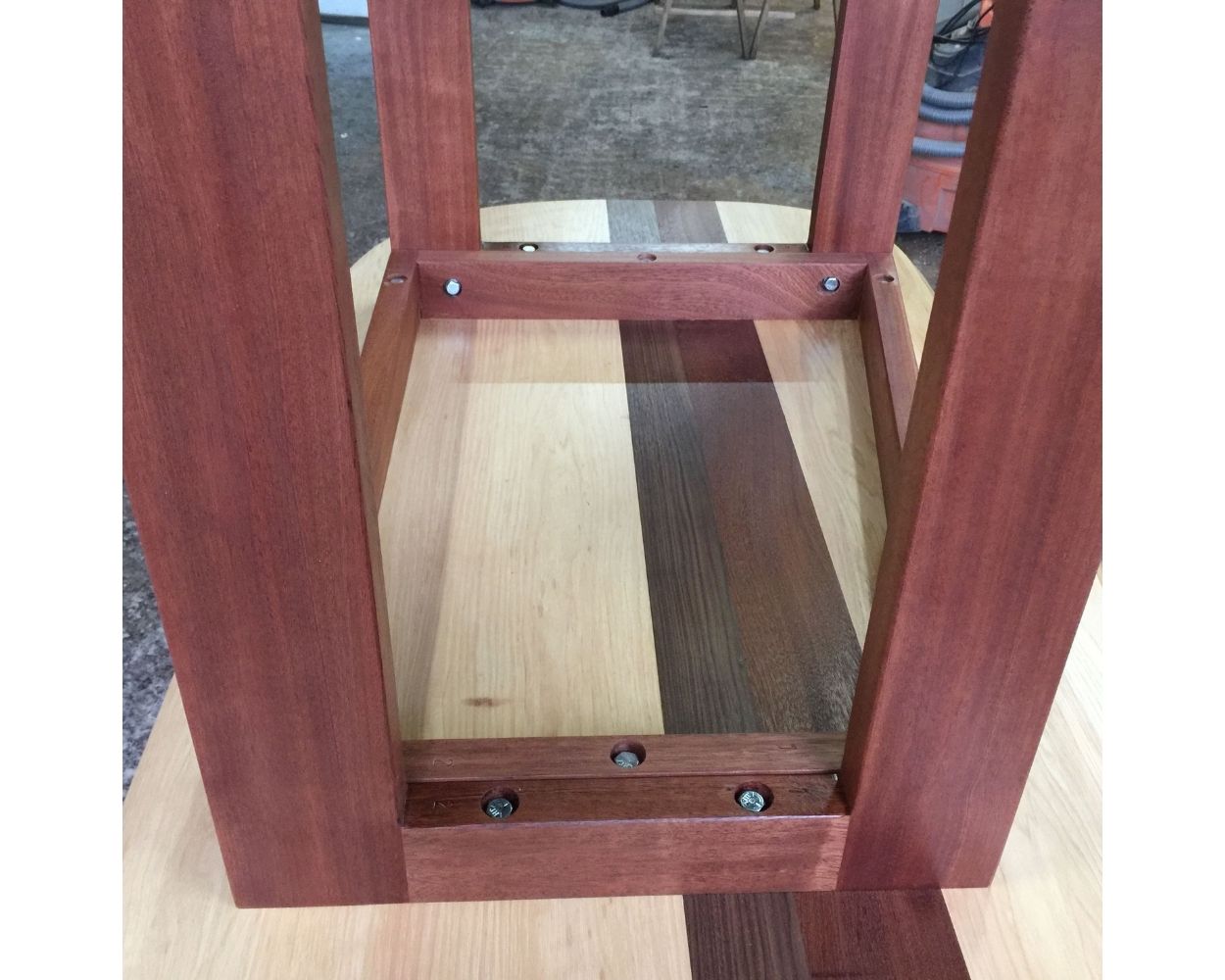 underside of an alder and walnut table