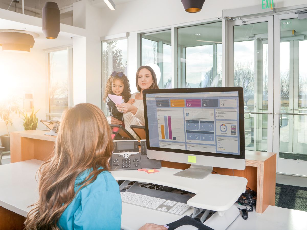 receptionist talking with a female guest