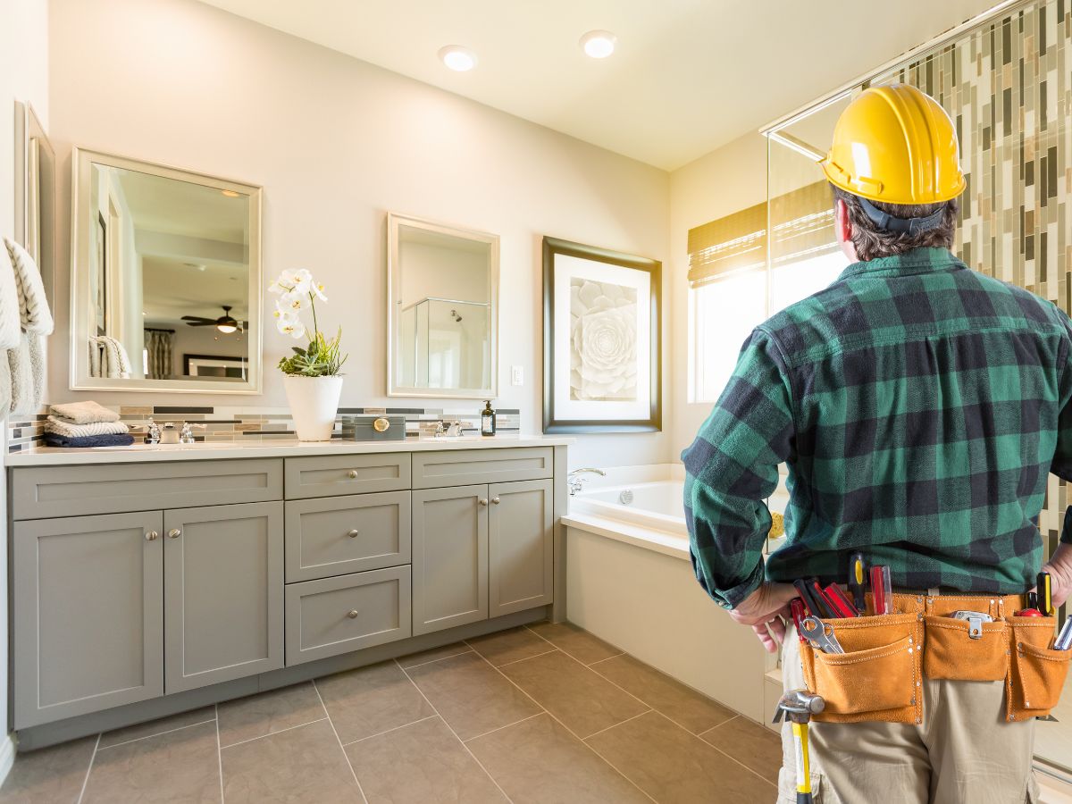 remodeler looking at a bathroom